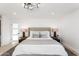 Stylish bedroom features a decorative ceiling fan and neutral-toned bedding for a relaxing ambiance at 11601 N 64Th Pl, Scottsdale, AZ 85254