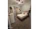 Cozy bedroom featuring light pink bed and eclectic decor and furniture at 12360 W Sherman St, Avondale, AZ 85323