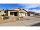 Beautiful home showcasing desert landscaping, a spacious driveway, and inviting curb appeal at 12360 W Sherman St, Avondale, AZ 85323