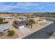 Aerial view of a neighborhood showcases the well-maintained homes and the neighborhood's proximity to shopping and dining at 12806 W Jadestone Dr, Sun City West, AZ 85375