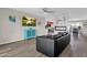 Open living room boasts modern fireplace and beautiful flow into dining area at 12806 W Jadestone Dr, Sun City West, AZ 85375