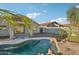 Enjoy the beautiful backyard with a private pool, lush landscaping and space to entertain at 13326 W Watson Ln, Surprise, AZ 85379