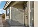 Charming front porch with a security screen door and a window offering natural light to the home's interior at 13326 W Watson Ln, Surprise, AZ 85379