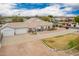 Aerial view of a home with desert landscaping and a spacious driveway leading to an attached two-car garage at 1349 E Anasazi St, Mesa, AZ 85203