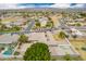 Expansive aerial view of a single-story home with a pool, RV parking, and lush landscaping in a peaceful neighborhood at 1349 E Anasazi St, Mesa, AZ 85203