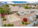 Aerial view of the home highlighting the roof, basketball court space, and garden with vibrant red bougainvillea at 1349 E Anasazi St, Mesa, AZ 85203