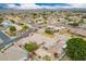 Wide aerial view of a desert neighborhood highlighting community layout and homes at 1349 E Anasazi St, Mesa, AZ 85203