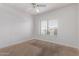 Bedroom with neutral carpet, a window with blinds, and a ceiling fan at 1349 E Anasazi St, Mesa, AZ 85203