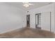 Bedroom with carpet, a window with blinds, closet, and bathroom access at 1349 E Anasazi St, Mesa, AZ 85203