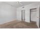 Bedroom with neutral carpet, closet, and bathroom access at 1349 E Anasazi St, Mesa, AZ 85203