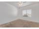 Bedroom with neutral carpet, a window with blinds, and ceiling fan at 1349 E Anasazi St, Mesa, AZ 85203