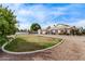 Well-maintained home with large front yard, decorative rock, and a circular driveway at 1349 E Anasazi St, Mesa, AZ 85203