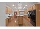 Bright kitchen featuring stainless steel appliances, center island, granite countertops, and ample cabinet space at 1349 E Anasazi St, Mesa, AZ 85203