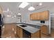 View of a kitchen featuring an island with granite countertops that flows into an open living space at 1349 E Anasazi St, Mesa, AZ 85203