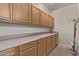 Spacious laundry room offers ample counter space and lots of storage at 1349 E Anasazi St, Mesa, AZ 85203