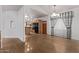 Hardwood floors seamlessly connect the living room to the kitchen with island and modern appliances at 1349 E Anasazi St, Mesa, AZ 85203