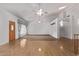 Spacious living area featuring vaulted ceilings, fans, and stylish window coverings, adjacent to the front entry at 1349 E Anasazi St, Mesa, AZ 85203