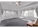 Bright living room with plush carpet, vaulted ceiling, decorative windows, and neutral walls at 1349 E Anasazi St, Mesa, AZ 85203