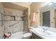 Bathroom featuring a tiled shower and white vanity at 13842 N 109Th Ave, Sun City, AZ 85351