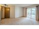 Bedroom featuring carpet flooring and sliding glass doors at 13842 N 109Th Ave, Sun City, AZ 85351