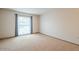 Bedroom featuring carpet flooring and large window at 13842 N 109Th Ave, Sun City, AZ 85351