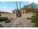 Inviting entry with brick pillars and ornate metal decorations, leading to a charming courtyard at 13842 N 109Th Ave, Sun City, AZ 85351