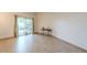 Bright living room featuring tile flooring and a sliding glass door at 13842 N 109Th Ave, Sun City, AZ 85351