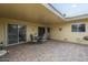 Covered patio features brick flooring and an outdoor dining set at 13842 N 109Th Ave, Sun City, AZ 85351