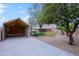 Backyard with carport, desert landscaping, and trees at 14005 N 19Th Way, Phoenix, AZ 85022