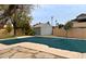 Private backyard pool with a -safe pool cover, storage shed, block wall and desert landscaping at 14005 N 19Th Way, Phoenix, AZ 85022