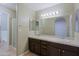 Bathroom featuring double sinks and a step-in shower at 14005 N 19Th Way, Phoenix, AZ 85022