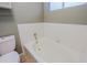 Bright bathtub with white tile and updated fixtures at 14005 N 19Th Way, Phoenix, AZ 85022