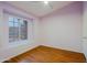 Bedroom with a ceiling fan, hardwood floors, a window and lavender colored walls at 14005 N 19Th Way, Phoenix, AZ 85022