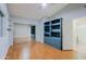 Bedroom with blue built-ins, mirrored closet, and ensuite bathroom at 14005 N 19Th Way, Phoenix, AZ 85022