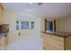 Adjacent dining area featuring tile floors and light filled windows with views of the backyard at 14005 N 19Th Way, Phoenix, AZ 85022