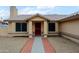 Close-up of the front porch featuring a red security door, neutral paint, and decorative brick walkway at 14005 N 19Th Way, Phoenix, AZ 85022