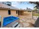 Backyard patio with a sparkling blue hot tub, desert landscaping and mountain views at 14005 N 19Th Way, Phoenix, AZ 85022