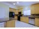 Beautiful kitchen featuring wooden cabinets, black appliances, granite countertops, and tile backsplash at 14005 N 19Th Way, Phoenix, AZ 85022