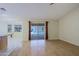 Open-concept living room with wood flooring, large sliding glass doors, and access to the patio at 14005 N 19Th Way, Phoenix, AZ 85022