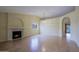 Open living room with wood floors, fireplace, and natural light at 14005 N 19Th Way, Phoenix, AZ 85022