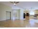 Open concept living area with wood floors and adjacent kitchen at 14005 N 19Th Way, Phoenix, AZ 85022