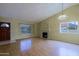 Bright living room featuring wood floors, fireplace, neutral paint, and multiple windows at 14005 N 19Th Way, Phoenix, AZ 85022