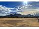 Expansive mountain view on a bright, partly cloudy day, featuring rolling hills and desert vegetation at 14005 N 19Th Way, Phoenix, AZ 85022