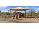 Community playground with slides, climbing structures, and a shaded canopy for Gathering fun at 14005 N 19Th Way, Phoenix, AZ 85022