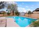 Backyard pool with desert landscaping and mountain views in the distance at 14005 N 19Th Way, Phoenix, AZ 85022