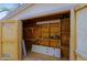 Interior view of a storage shed with shelving units and a workbench at 14005 N 19Th Way, Phoenix, AZ 85022