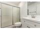 An updated bathroom with a sliding glass door to the shower at 14408 N 35Th Ave, Phoenix, AZ 85053