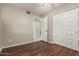 A bedroom that boasts wood-style flooring, a ceiling fan and large closet at 14408 N 35Th Ave, Phoenix, AZ 85053