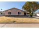 Charming single-story home with a stone accent facade and mature desert landscaping at 14408 N 35Th Ave, Phoenix, AZ 85053