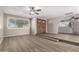 Spacious open living room with wood-look floors and lots of natural light at 14408 N 35Th Ave, Phoenix, AZ 85053